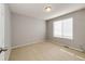 Clean, light-filled bedroom with a neutral color palette, carpet flooring, and large window perfect for relaxation at 23201 E Orchard Pl, Aurora, CO 80015