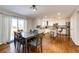 Inviting dining area adjacent to the kitchen, featuring hardwood floors, table and a sliding glass door at 23201 E Orchard Pl, Aurora, CO 80015