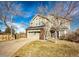Beautiful home with a two-car garage and manicured lawn at 23201 E Orchard Pl, Aurora, CO 80015