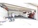 Spacious garage with ample storage cabinets, shelving, and room for multiple vehicles at 23201 E Orchard Pl, Aurora, CO 80015