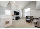 Spacious living room features vaulted ceilings, fireplace, and large windows at 23201 E Orchard Pl, Aurora, CO 80015