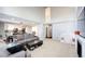 View of living room with hardwood floors, modern furnishings, and an adjacent kitchen at 23201 E Orchard Pl, Aurora, CO 80015