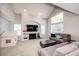 Bright living room with vaulted ceilings, fireplace, and large windows at 23201 E Orchard Pl, Aurora, CO 80015