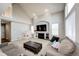 Open-concept living room with vaulted ceilings, fireplace, and lots of natural light at 23201 E Orchard Pl, Aurora, CO 80015