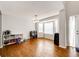 Well-lit living room featuring hardwood floors, large windows, and neutral wall colors at 23201 E Orchard Pl, Aurora, CO 80015