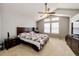 Spacious main bedroom features vaulted ceilings, a ceiling fan, and large windows that provide ample natural light at 23201 E Orchard Pl, Aurora, CO 80015