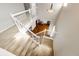 View from the top of the staircase looking down to the first floor of the home at 23201 E Orchard Pl, Aurora, CO 80015