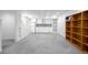Open basement area with a convenient kitchenette and shelving for storage at 1448 E Maplewood Ct, Centennial, CO 80121
