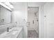 Modern bathroom featuring a glass-enclosed shower and stylish fixtures, marble vanity at 1448 E Maplewood Ct, Centennial, CO 80121
