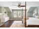 Light-filled primary bedroom features a four-poster bed, a ceiling fan, and custom built-ins at 1448 E Maplewood Ct, Centennial, CO 80121