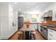 Bright, renovated kitchen with stainless steel appliances, a large center island, and modern finishes at 1448 E Maplewood Ct, Centennial, CO 80121