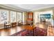 Bright living room with hardwood floors, elegant furniture, and ample natural light from the windows at 1448 E Maplewood Ct, Centennial, CO 80121