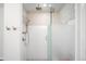Modern bathroom features a tiled walk-in shower with glass door at 1448 E Maplewood Ct, Centennial, CO 80121