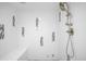 Updated shower with built-in seat, modern fixtures and blue mosaic tile accents at 1448 E Maplewood Ct, Centennial, CO 80121