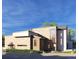 Modern home featuring a stone and white exterior, unique window design, and a well-maintained landscape at 1055 Greens Pl, Erie, CO 80516
