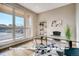 Bright home office with large windows and built-in shelving at 1055 Greens Pl, Erie, CO 80516