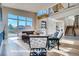 Bright living room with high ceilings, large windows, and a modern fireplace at 1055 Greens Pl, Erie, CO 80516