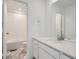 Bathroom with single vanity, white cabinets, and a shower/tub combo at 196 Kino Ct, Brighton, CO 80601