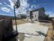 Backyard features a basketball hoop, gray home, and a partial-grass yard with trampoline at 914 Peach Leaf Ln, Elizabeth, CO 80107