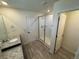 Bathroom features granite countertops, dual sinks, and glass shower at 914 Peach Leaf Ln, Elizabeth, CO 80107