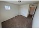 Simple bedroom with neutral carpet and a closet with sliding doors, plus a window at 914 Peach Leaf Ln, Elizabeth, CO 80107