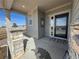 Inviting front porch with stone pillars and a black front door, enhancing curb appeal and welcome at 914 Peach Leaf Ln, Elizabeth, CO 80107
