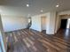 Spacious living room boasts beautiful wood flooring and recessed lighting at 914 Peach Leaf Ln, Elizabeth, CO 80107