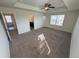 Expansive main bedroom features a tray ceiling and natural light at 914 Peach Leaf Ln, Elizabeth, CO 80107