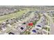 Aerial view of community and property highlighted with neighborhood and nearby open space at 22472 E Narrowleaf Cir, Aurora, CO 80016