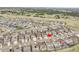 Aerial view shows homes in the neighborhood and nearby shopping at 22472 E Narrowleaf Cir, Aurora, CO 80016
