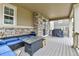 This back porch features outdoor seating and a BBQ grill for outdoor cooking at 22472 E Narrowleaf Cir, Aurora, CO 80016