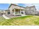 A well-maintained backyard and covered patio create a perfect outdoor retreat at 22472 E Narrowleaf Cir, Aurora, CO 80016