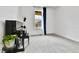 Minimalist-style room featuring a piano and a window with bright natural light streaming into the space at 22472 E Narrowleaf Cir, Aurora, CO 80016