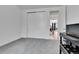 Minimalist bedroom with a closet and open doorway to the staircase and hall of the home at 22472 E Narrowleaf Cir, Aurora, CO 80016