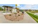 Community park with walking path, map, playground, bike racks, and gathering area at 22472 E Narrowleaf Cir, Aurora, CO 80016