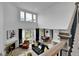 Open-concept living space with a fireplace, dining area, lots of natural light, and modern decor at 22472 E Narrowleaf Cir, Aurora, CO 80016