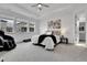Bright main bedroom boasts large windows, a ceiling fan, and a view of the neighborhood homes at 22472 E Narrowleaf Cir, Aurora, CO 80016