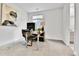 Home office with a modern desk, comfortable chair, and view to the bathroom creating a functional and stylish workspace at 22472 E Narrowleaf Cir, Aurora, CO 80016