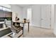 Well-lit home office featuring a modern desk, a comfortable chair, and a view into the bathroom, perfect for work at 22472 E Narrowleaf Cir, Aurora, CO 80016