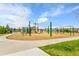 The playground offers swings, slides and various climbing structures for children to explore at 22472 E Narrowleaf Cir, Aurora, CO 80016