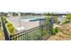 The community pool area has multiple umbrellas and outdoor furniture with fences around at 22472 E Narrowleaf Cir, Aurora, CO 80016