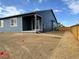 Backyard of home featuring a covered patio, fence, and newly laid ground at 17170 E 90Th Pl, Commerce City, CO 80022