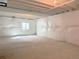 Unfinished basement featuring sealed walls and one small window at 17170 E 90Th Pl, Commerce City, CO 80022