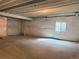 Unfinished basement with a sealed wall and a small window at 17170 E 90Th Pl, Commerce City, CO 80022
