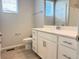 Bathroom features a white vanity with modern hardware, a toilet, and a shower at 17170 E 90Th Pl, Commerce City, CO 80022