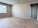 A bright and airy bedroom space with ample natural light and neutral decor at 17170 E 90Th Pl, Commerce City, CO 80022