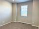 Bright bedroom features neutral walls, carpet floors, and a window at 17170 E 90Th Pl, Commerce City, CO 80022