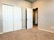 Bedroom features new carpet, and a closet with white sliding doors for ample storage at 17170 E 90Th Pl, Commerce City, CO 80022
