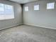 Bright bedroom features neutral walls, carpet floors, and three windows at 17170 E 90Th Pl, Commerce City, CO 80022