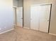 Bedroom features new carpet, and a closet with white sliding doors for ample storage at 17170 E 90Th Pl, Commerce City, CO 80022